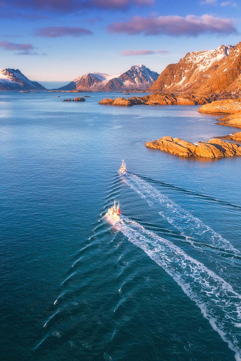 aerial-view-of-fishing-boats-rocks-in-the-blue-se-2024-12-02-14-47-07-utc